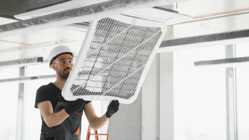 professional technician cleaning an air duct