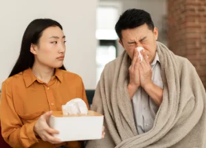 man suffering from allergies, likely triggered by mold spores