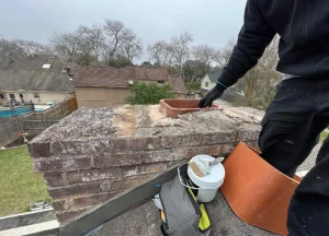 skilled technician performing chimney repairs to enhance safety