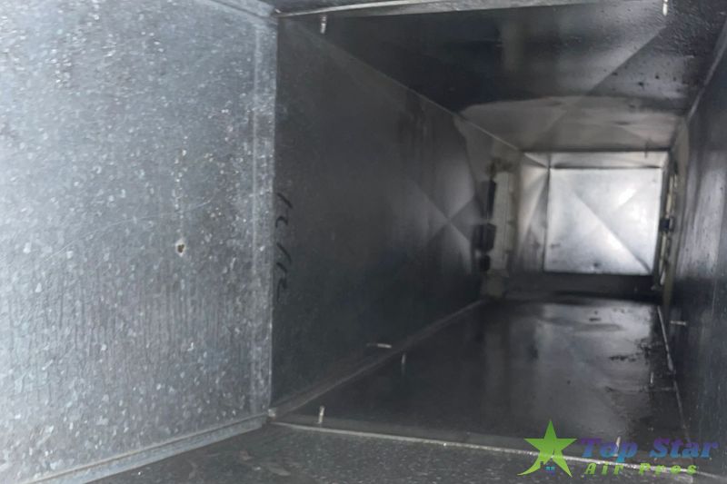 image of a duct after hvac ductwork cleaning 