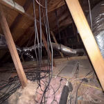 Old attic insulation and debris in Pasadena Texas home